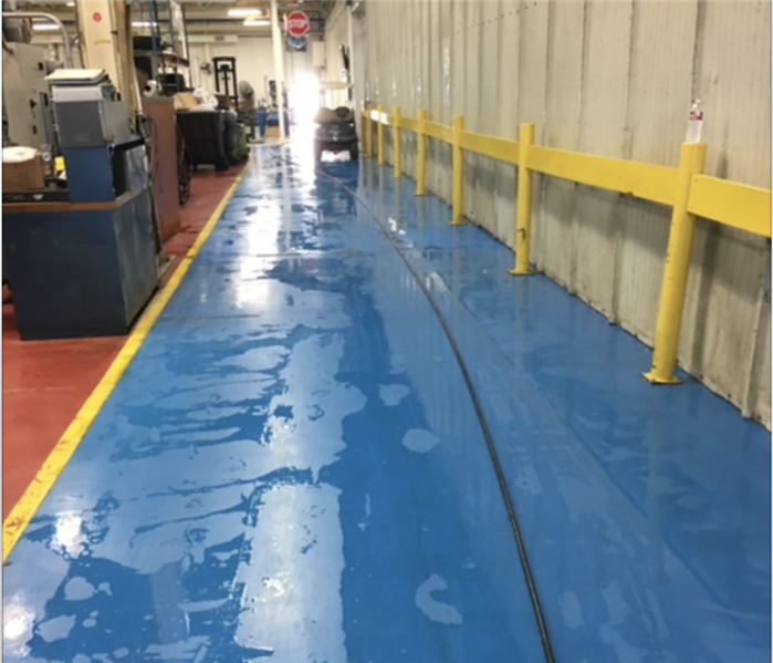 A commercial property with wet floors after a water loss.