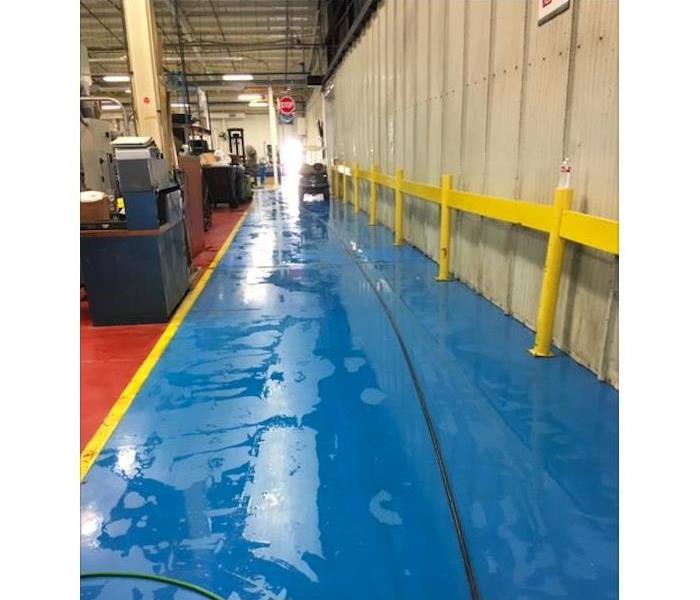 Water on floors in warehouse.